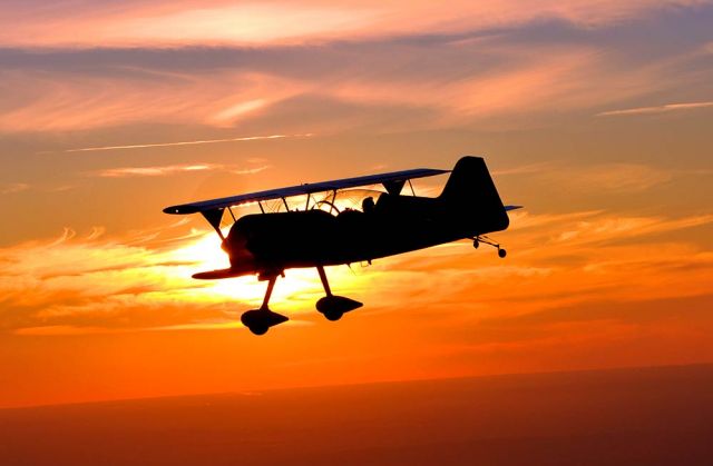 PITTS Special (S-1) (PI-TTS) - This photo was a lucky shot of Greg Connell flying end of the day headed home. Gregs new Pitts Model 12 is amazing to shoot. Photo credit Dean Wingard