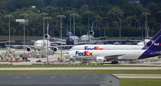 McDonnell Douglas DC-10 (N306FE) - A sight soon gone. Three MD-10s in one photo with a bonus MD-11!