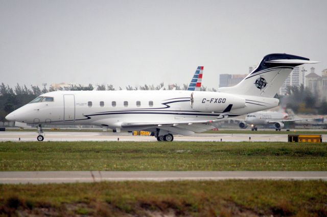 Bombardier Challenger 300 (C-FXGO) - Chartright Air Challenger 300 lining up to depart rwy 10L on 19-Mar-19 returning to CYYZ as HRT242 after a two-day visit.