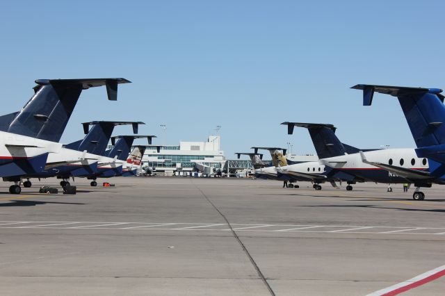 Beechcraft 1900 (N240GL) - A gaggle of Beech 1900D's from Great Lakes parked out on the east end of concourse A at DIA.