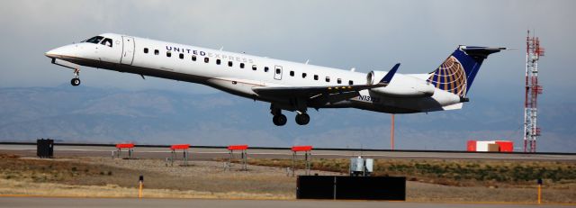 Embraer EMB-145XR (N13123) - Landing on 16L.