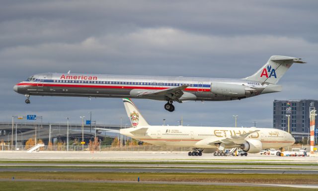 McDonnell Douglas MD-83 (N565AA) - Etihad A6-ETQ waits for her gate in the background