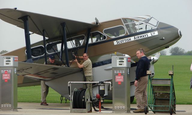 De Havilland Dragon Rapide (G-AGJG) - De Havilland DH89A dragon Rapide at the fuel pumps at Sywell UK