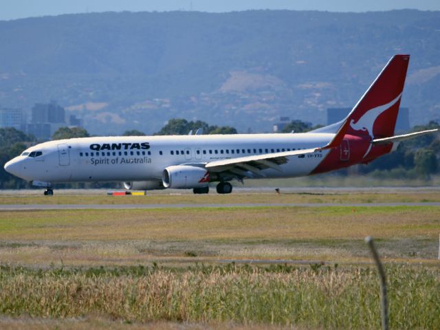 Boeing 737-800 (VH-VXG) - On taxi-way heading for Terminal One, after landing on runway 23. Thursday 12th April 2012.