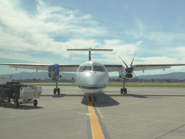 de Havilland Dash 8-400 (N417QX) - This was the plane that was involved in the emergency landing at KSJC and as you can see that the number 2 engine propeller is removed.