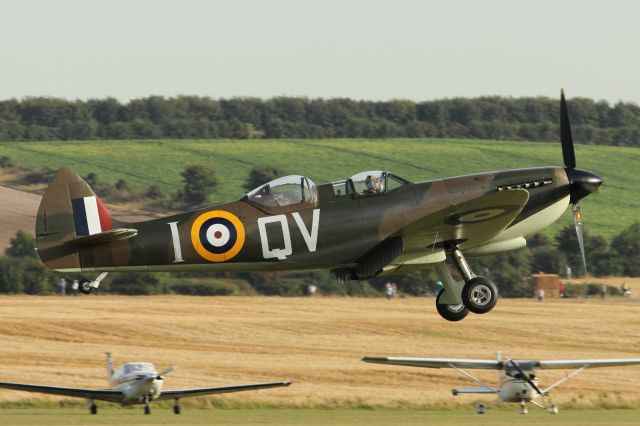 — — - Two seater, Supermarine Spitfire about to land.