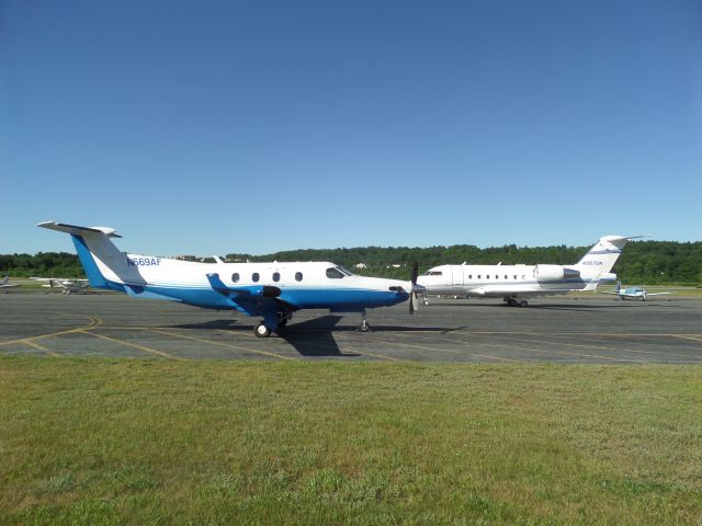 Pilatus PC-12 (N669AF) - N669AF with N267DW taxiing to park behind it.