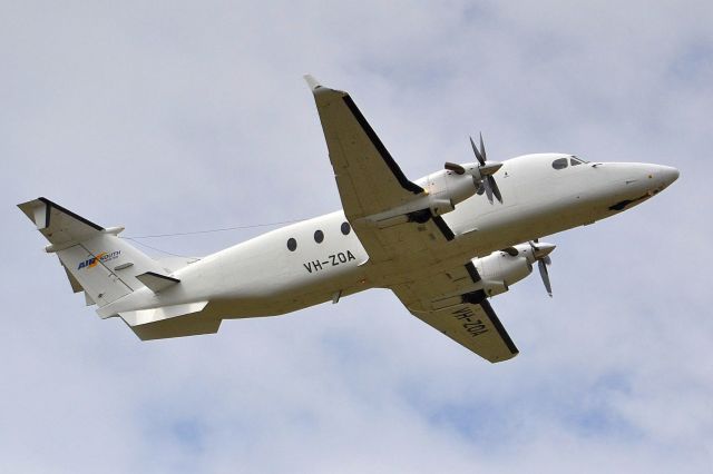 Beechcraft 1900 (VH-ZOA) - Getting airborne off runway 23. Friday 5th October 2012.