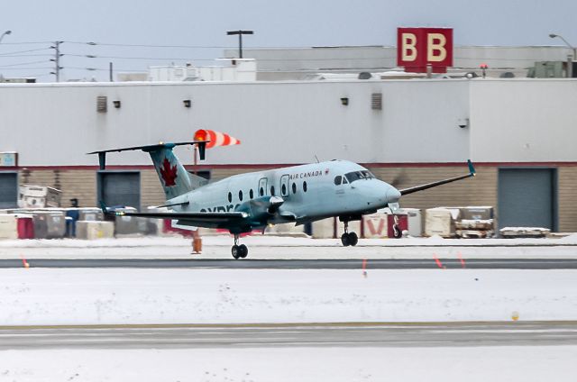 Beechcraft 1900 (C-GORF) - Air Canada C-GORF Beech 1900D landing in crosswind