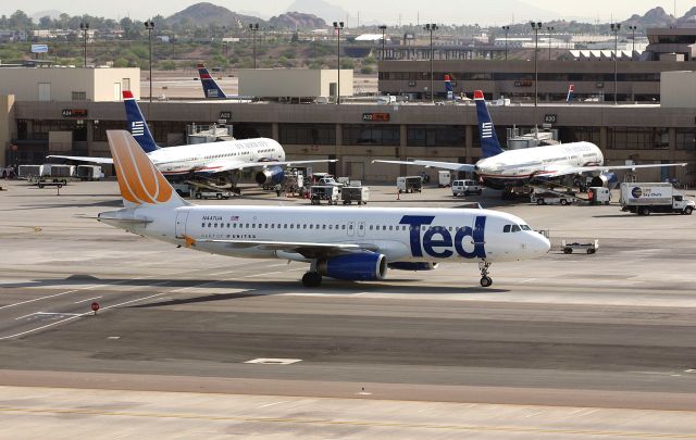 Airbus A320 (N447UA) - KPHX - loved my trips to PHX before I remarried, I could sit here all day like this, moving between the upper floors parking structures, moving north side, south side, east or west of the 'chute' I took several hours of video here, and thousands of photos. I havent been back in awhile but I hear the new Tramway might be an new place to photo from....End of United "TED" shown here on taxi to departure photographed from atop the parking structure showing some other long ago? airline...Mar 20 2007 here.