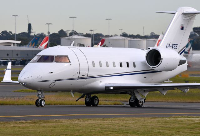 Canadair Challenger (VH-VSZ) - Shiny Challenger 600 taxying out  for Orange on a partly cloudy and freezing winter morning.