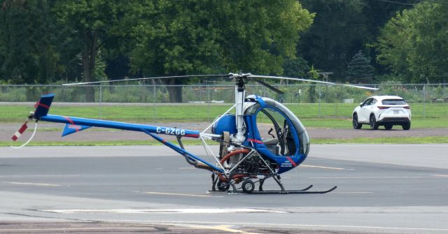 SCHWEIZER 269 (C-GZGG) - Catching some tarmac time is this 2005 Schweizer 300CBi (269C-1) Helicraft in the Summer of 2023.