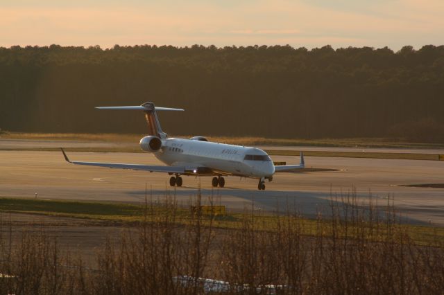 Canadair Regional Jet CRJ-700 (N398CA) - N398CA taxiing to runway 23R for departure to KDTW