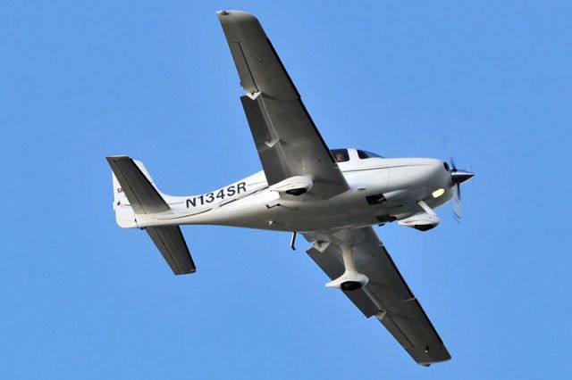 Cirrus SR-20 (N134SR) - On short final approach over the Golf Course Village section of Miami Lakes enroute to runway 9-L at Opa-locka Executive Airport on January 26, 2012.