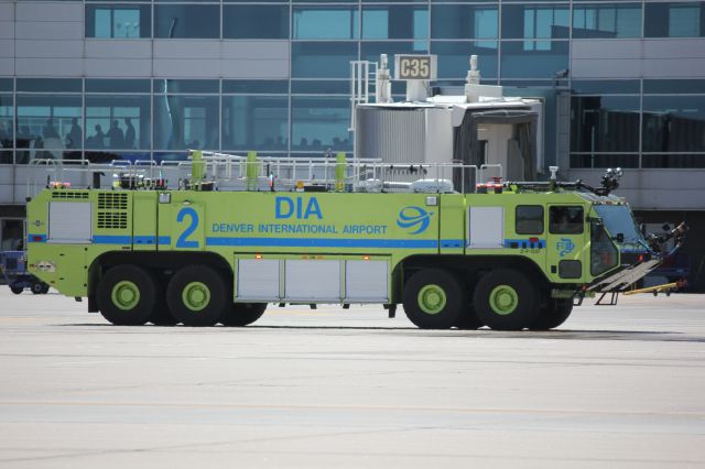 Boeing 737-800 (N8301J) - Fire truck waiting for 737-800 to pull up to the gate.