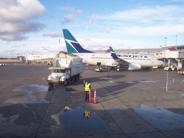 Boeing 737-700 (C-FWSK) - WestJet at gate Edmonton Alberta