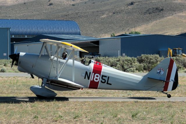 Beechcraft Baron (58) (N185L) - A 1965 Liberty Sport biplane taxies to a parking space after having just landed on runway 27 at the Carson City (Nevada) airport.  The aircraft had arrived to participate in the 2009 Wings Over Carson open house day activities at CXP.