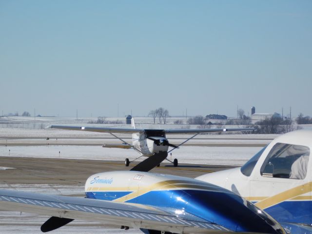 Cessna Skyhawk (N472D) - A clear day in January meant a busy day of flying for University of Dubuque Aviation students.  In this case a nearly empty ramp was a good thing!!!  N472D taxis to park after landing with a company Piper Seminole watching.