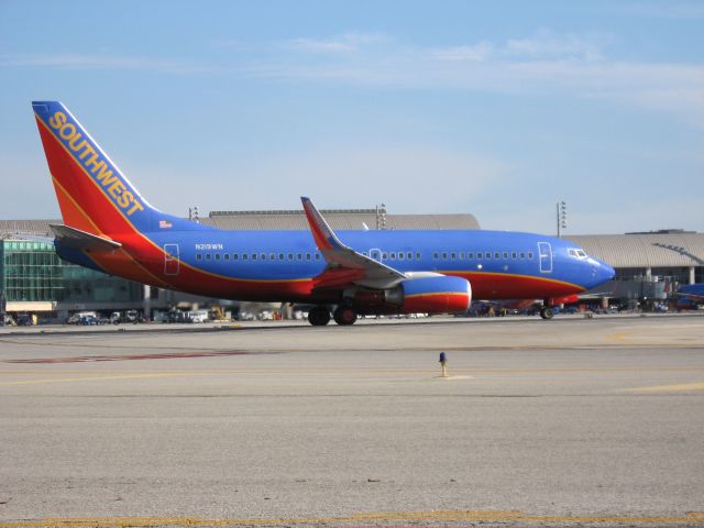 Boeing 737-700 (N219WN) - Holding on RWY 19R