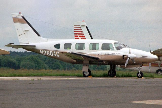 Piper Navajo (N250AC) - Seen here in May-03.