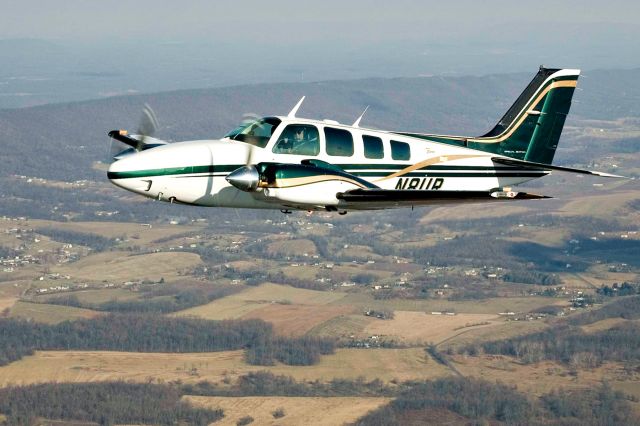 Beechcraft Baron (58) (N8UR) - Close formation.