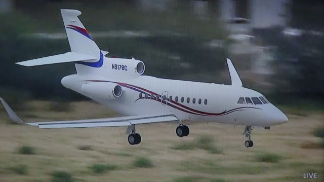 Dassault Falcon 900 (N917BC) - Screen capture of Golf Cannel live video of Dassault Falcon 900 (Tail #N917BC) landing at Scottsdale FBO, AZ (KSDL) at 2:40 PM MST, captured by Ian Steer, Toronto, ON