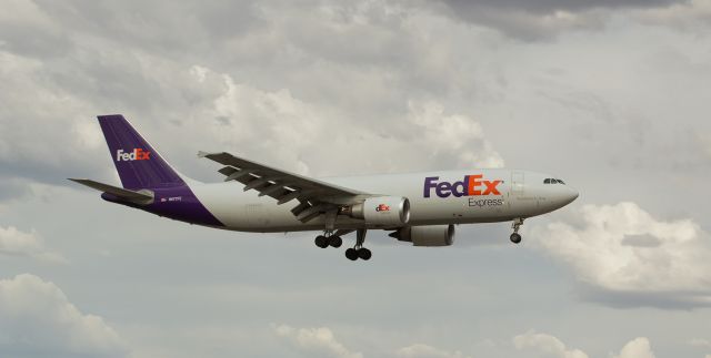 Airbus A300F4-600 (N677FE) - On a rare cloudy day in northern Nevada, "Clifford" (N677FE), an A306, makes its late afternoon s/final approach to Reno Tahoe Internationals runway 16R.