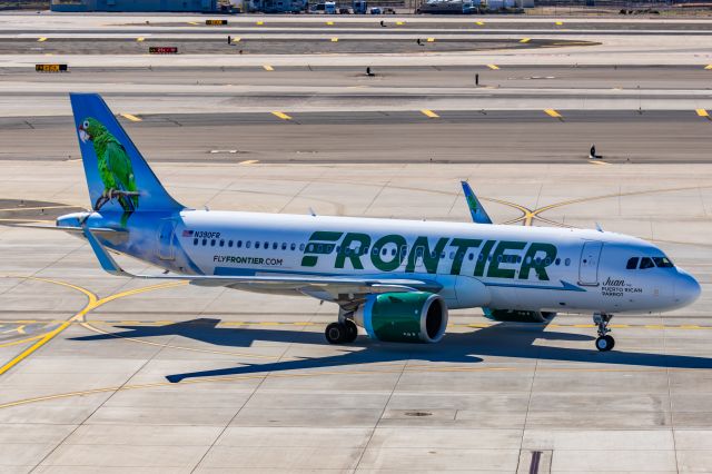 Airbus A320neo (N309FR) - A Frontier Airlines A320 neo "Juan the Puerto Rican Parrot" taxiing at PHX on 2/10/23 during the Super Bowl rush. Taken with a Canon R7 and Canon EF 100-400 II L lens.