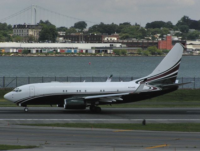 N134AR — - Boeing 737-7AH (BBJ) N134AR on departure roll on Runway 31 at KLGA on July 15,2004. Note their are only 8 cabin windows on the left side of the fuselage, unusual even for a BBJ. This Beautiful aircraft still visits LGA regularly with an even more beautiful scheme now registered N888TY.