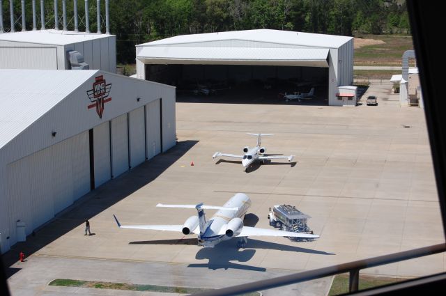 Embraer ERJ-135 (N617WA) - ERJ-135 and a LJ parked at Wing. The picture was taken from Lone Star Tower.