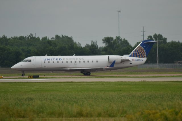 Canadair Regional Jet CRJ-200 (N929EV) - N929EV waiting to depart on Runway 15 in Sioux Falls SD on 6-12-15