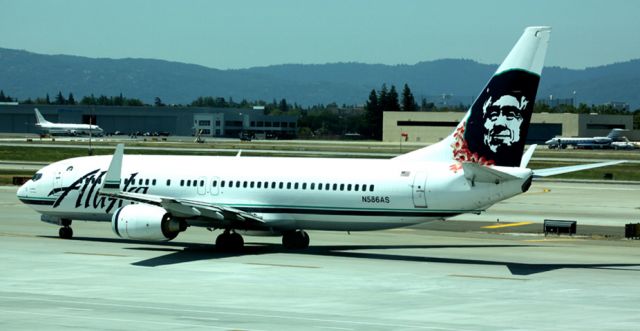 Boeing 737-700 (N586AS) - Taxiing to 30R for take off.