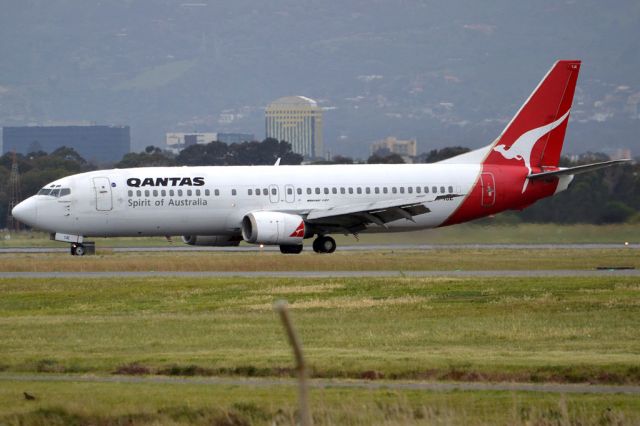 BOEING 737-400 (VH-TJE) - On taxi-way heading for Terminal 1 after landing on runway 23. Friday 5th October 2012.