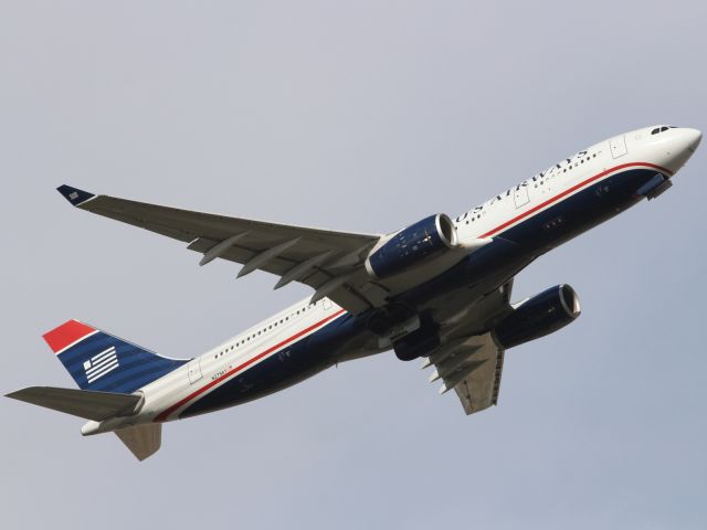 Airbus A330-200 (N279AY) - US Airways A330-200, seen here departing runway 09R at LHR.