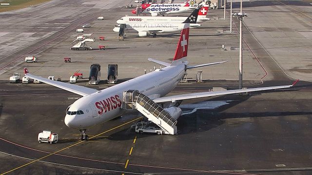 Airbus A330-300 — - Light snow starting to fall at Zurich. 