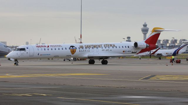 Bombardier CRJ-1000 (EC-MXA) - Valencia footie team colors.