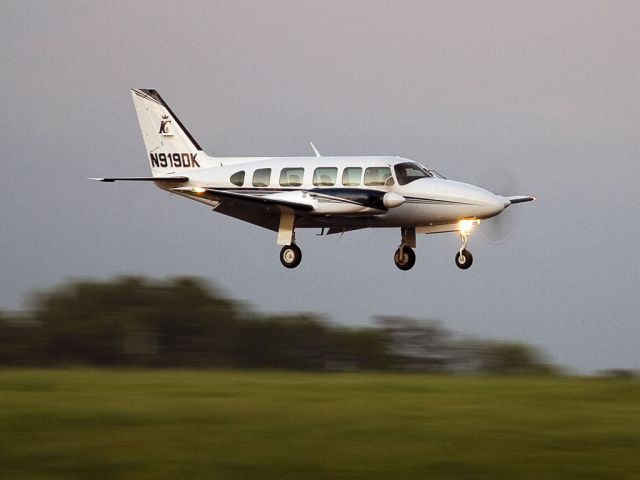 Piper Navajo (N919DK) - A nice crosswind landing on runway 18L, Charlotte, North Carolina, USA. The sun had gone down and this photo was taken in the last light of the day.