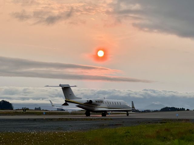 Learjet 45 (N1925B) - Went to bike across the bridge to the airport, saw this LJ coming in, and the sun was a bright orange, so it made for a good shot.