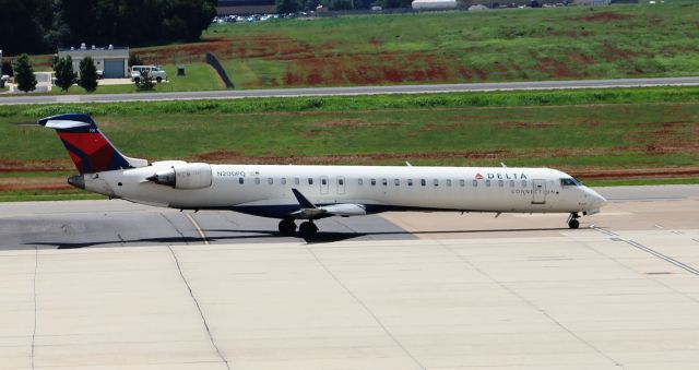 Canadair Regional Jet CRJ-900 (N200PQ) - A Bombardier CRJ-900LR moving off the commercial ramp and onto a taxi way @ Huntsville International - August 15, 2016