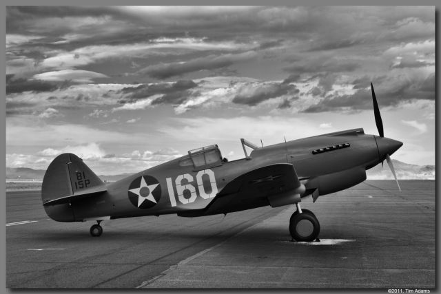 — — - Just restored P-40C owned by Rod Lewis on the ramp at Stead, NV.