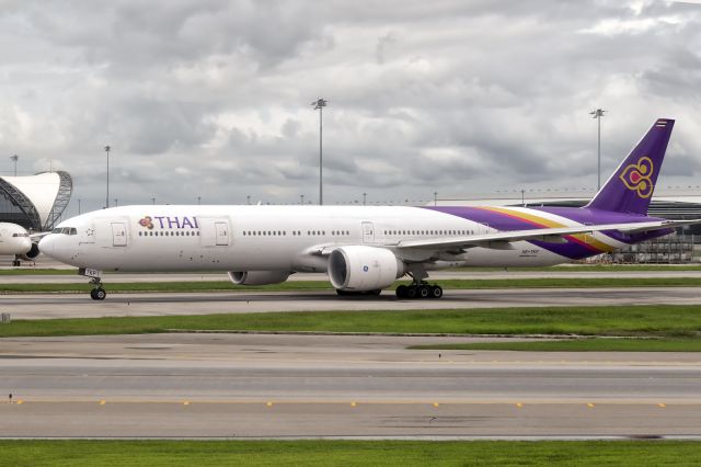 BOEING 777-300ER (HS-TKP) - 27th May, 2025:  Flight TG 634 taxiing for departure to Taipei. Photograph shot from EVA Air flight BR 212 also heading to the same destination.