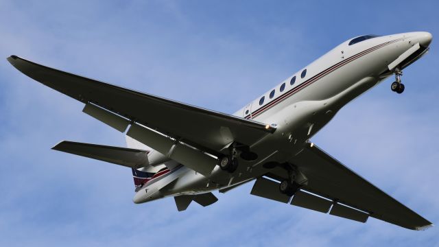Cessna Citation Latitude (N684QS) - “Execjet (1I/EJA) 684” br /br /N684QS, a NetJets 2019 Cessna 680A Citation Latitude, SN 680A-0215, just overhead on very short final for 5L at KIND. 5/3/23