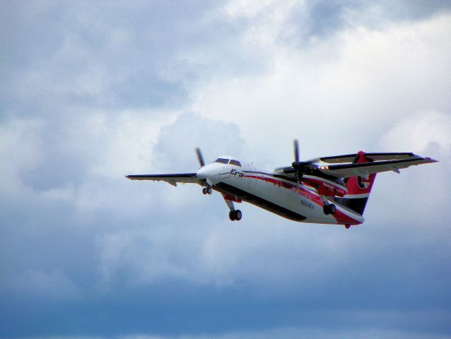 — — - Dash 8 climbing out and retracting landing gear.