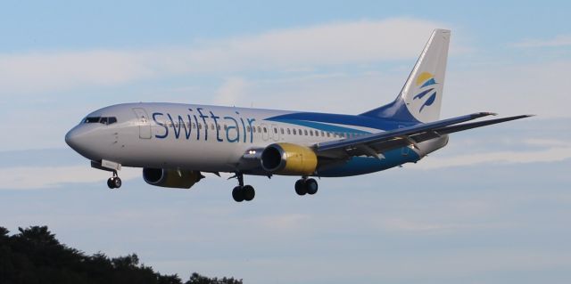 BOEING 737-400 (N804TJ) - A Swift Air Boeing 737-401 arriving 36R at Carl T. Jones Field, Huntsville International Airport, AL - October 17, 2018. Photo taken about 4:15pm from outside the airport perimeter fence along the taxiway paralleling 36R.