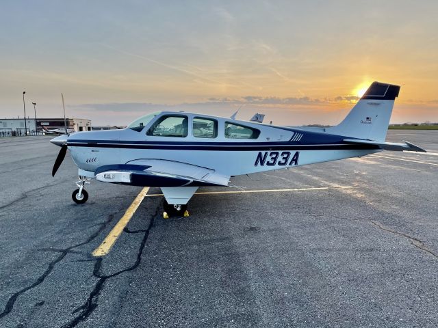 Beechcraft Bonanza (33) (N33A) - Parked at sunset.