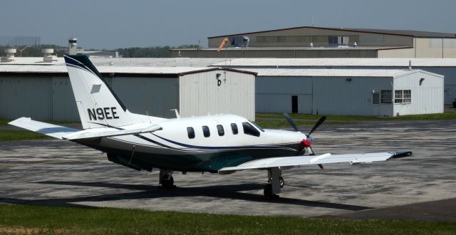 Socata TBM-700 (N9EE) - Catching some tarmac time is this 2003 Socata TBM-700 in the Spring of 2022.