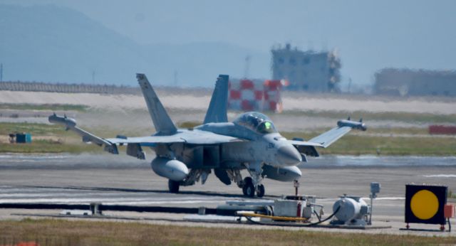 — — - This growler belong to VAQ-VAQ-141 (Shadowhawks) is taxing off the runway and onto bravo.