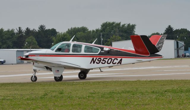 Beechcraft 35 Bonanza (N950CA) - Bonanza Mass Arrival at Oshkosh AirVenture 2014.