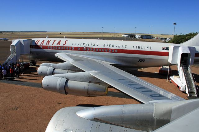 Boeing 707-100 (VH-XBA) - Picture taken while on the wing of a 747-200 VH-EBQ at Longreach Queensland Australia.