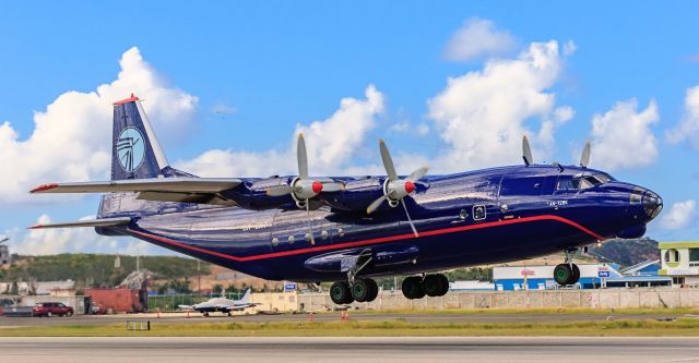 Antonov An-12 (UR-CNT) - Antonov 12 Ukraine Air Alliance call sign UKL5006 registration UR-CNT departing TNCM St Maarten on 20-12-2017 crossing the big pond with lots of pollution cant done!!!